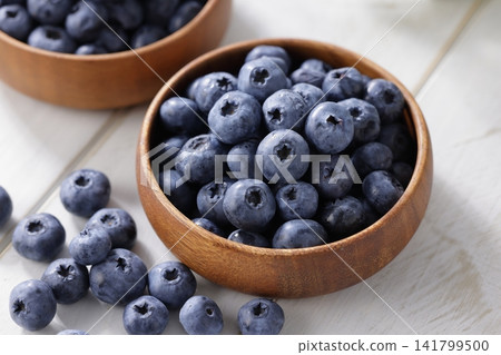 Fresh blueberries arranged on a plate Fresh blueberries arranged on a plate 141799500