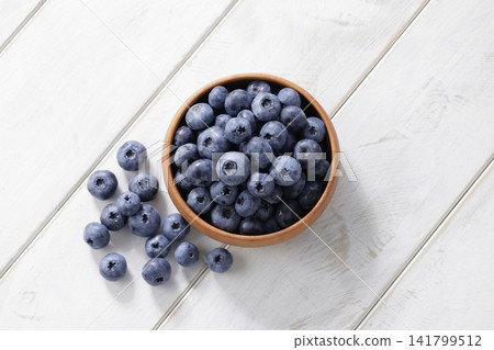 Fresh blueberries arranged on a plate Fresh blueberries arranged on a plate 141799512