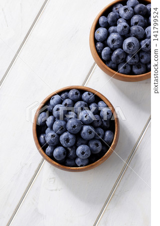 Fresh blueberries arranged on a plate Fresh blueberries arranged on a plate 141799524
