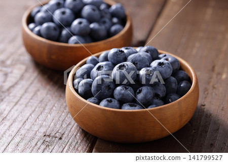 Fresh blueberries arranged on a plate Fresh blueberries arranged on a plate 141799527