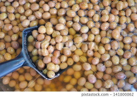 Olives soaking in water at a processing location Olives soaking in water at a processing location 141800862