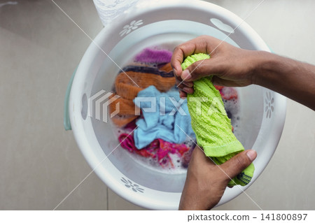 Washing colorful towels in a laundry basket Washing colorful towels in a laundry basket 141800897