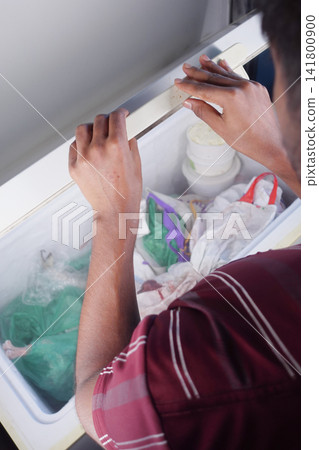 Looking into a freezer filled with various items Looking into a freezer filled with various items 141800900