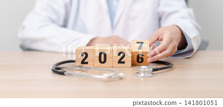 2026 end year to Happy New Year 2027 with Stethoscope of doctor and heart shape on table. health care, Insurance, Wellness and medical concepts 2026 end year to Happy New Year 2027 with Stethoscope of doctor and heart shape on table. health care, Insurance, Wellness and medical concepts 141801051
