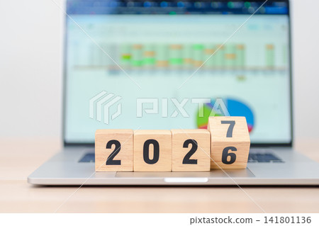 2026 end year to Happy New Year 2027 block with computer laptop background. Goal, Target, Resolution, strategy, plan, Action, mission, motivation, and New Year start concepts 141801136