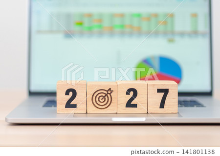 Happy New Year 2027 block with dartboard icon against computer laptop background. Goal, Target, Resolution, strategy, plan, Action, mission, motivation, and New Year start concepts Happy New Year 2027 block with dartboard icon against computer laptop background. Goal, Target, Resolution, strategy, plan, Action, mission, motivation, and New Year start concepts 141801138
