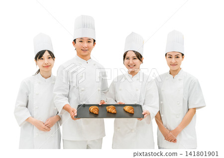 Chefs and cooks in chef coats standing in the kitchen Chefs and cooks in chef coats standing in the kitchen 141801901