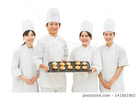 Chefs and cooks in chef coats standing in the kitchen Chefs and cooks in chef coats standing in the kitchen 141801902