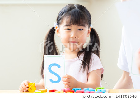 Early childhood education Girls taking lessons in an English conversation class Early childhood education Girls taking lessons in an English conversation class 141802546