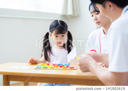 Early childhood education Girls taking lessons in an English conversation class Early childhood education Girls taking lessons in an English conversation class 141802619