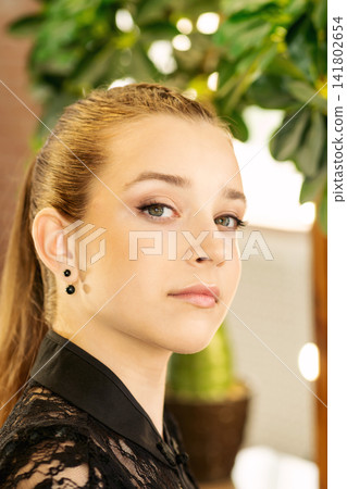 Teen Girl With Finished Makeup Near Illuminated Salon Mirror Teen Girl With Finished Makeup Near Illuminated Salon Mirror 141802654