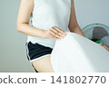 Hands woman making bed at home in the morning,Make a bed 141802770