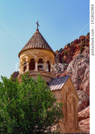Noravank church with conical roof and cross atop Noravank church with conical roof and cross atop 141802969