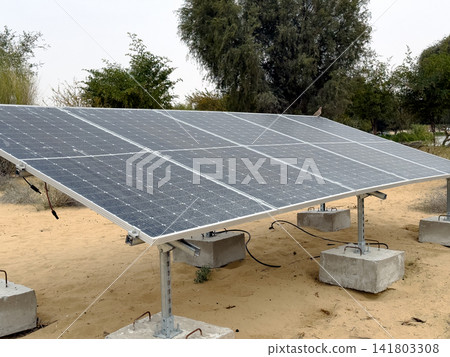 A solar power plant for clean energy production has been installed in the desert. Renewable energy in remote areas. A solar power plant for clean energy production has been installed in the desert. Renewable energy in remote areas. 141803308
