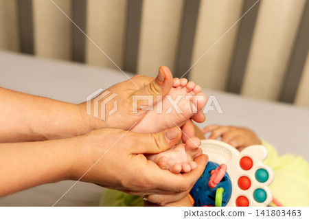 Baby Boy Touches Mother Chin During Playful Window Moment Baby Boy Touches Mother Chin During Playful Window Moment 141803463