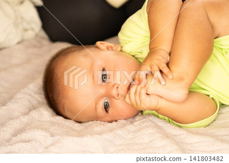 Baby Boy Touches Mother Chin During Playful Window Moment Baby Boy Touches Mother Chin During Playful Window Moment 141803482