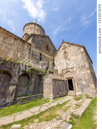 Armenian Tatev monastery complex with arched walkways and open doorway Armenian Tatev monastery complex with arched walkways and open doorway 141803649