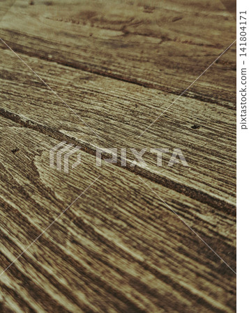 Close-up diagonal texture of old weathered wood with natural grain lines and scratches, rustic timber wooden background. Close-up diagonal texture of old weathered wood with natural grain lines and scratches, rustic timber wooden background. 141804171