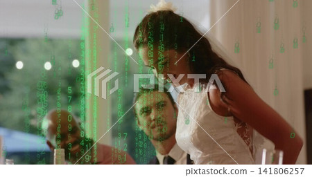 Speaking bride in white lace gown hairpiece, leaning at reception table, green overlay, copy space Speaking bride in white lace gown hairpiece, leaning at reception table, green overlay, copy space 141806257