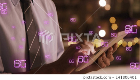 Tapping male professional operating tablet at night, with 6G holograms, light shirt and striped tie Tapping male professional operating tablet at night, with 6G holograms, light shirt and striped tie 141806401