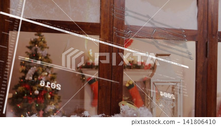 Framing wooden window panes showing cozy living room with tree, stockings, reflections, faux snow Framing wooden window panes showing cozy living room with tree, stockings, reflections, faux snow 141806410