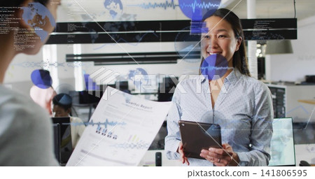 Holding tablet and smiling Korean woman in top reading glass overlay in office with Quarter Report Holding tablet and smiling Korean woman in top reading glass overlay in office with Quarter Report 141806595
