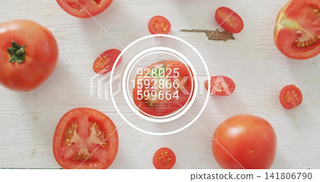Displaying centered halved tomato showing overlay on pale board, with whole tomatoes, cherry slices Displaying centered halved tomato showing overlay on pale board, with whole tomatoes, cherry slices 141806790