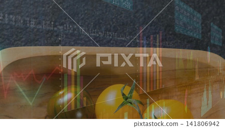 Showing three golden cherry tomatoes with green stems sitting in wooden bowl on counter with charts Showing three golden cherry tomatoes with green stems sitting in wooden bowl on counter with charts 141806942