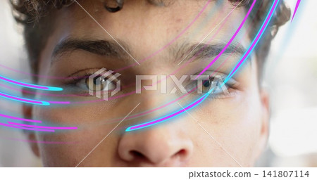 Holding steady gaze male filling frame in studio, showing eyes nose brows skin, neon trails, bokeh Holding steady gaze male filling frame in studio, showing eyes nose brows skin, neon trails, bokeh 141807114