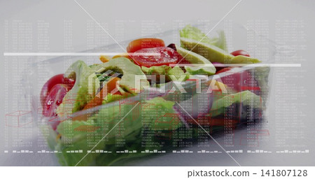 Showing clear plastic clamshell with salad on white table showing lid condensation and data overlay Showing clear plastic clamshell with salad on white table showing lid condensation and data overlay 141807128