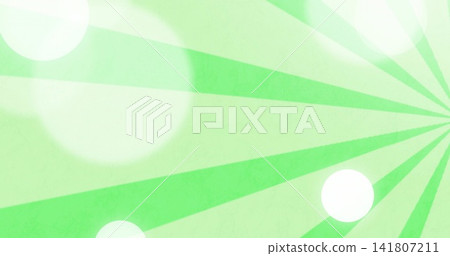Radiating green radial sunburst fanning left on canvas showing white bokeh and faint grain vignette Radiating green radial sunburst fanning left on canvas showing white bokeh and faint grain vignette 141807211
