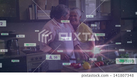 Slicing senior couple in home kitchen, man in apron, woman in yellow, with knife and overlays Slicing senior couple in home kitchen, man in apron, woman in yellow, with knife and overlays 141807348