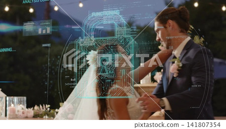 Dancing couple holding hands at garden reception in gown and suit with veil, holo padlock overlay Dancing couple holding hands at garden reception in gown and suit with veil, holo padlock overlay 141807354