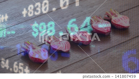 Displaying five halved striped beets showing rings on dark wood plank with financial tickers $98 Displaying five halved striped beets showing rings on dark wood plank with financial tickers $98 141807459