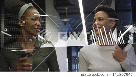 Walking colleagues talking in office, in dark green and white, holding coffee, with digital charts Walking colleagues talking in office, in dark green and white, holding coffee, with digital charts 141807945