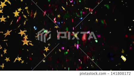 Falling gold star cluster shimmering on black set, with rainbow foil and glitter, copy space Falling gold star cluster shimmering on black set, with rainbow foil and glitter, copy space 141808172