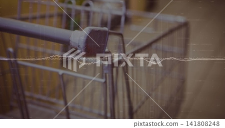 Focusing metal cart handle showing chipped paint and rust at retail entrance, with film waveform Focusing metal cart handle showing chipped paint and rust at retail entrance, with film waveform 141808248