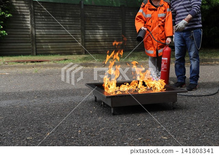 fire prevention. corporate safety - exercise during a firefighting course fire prevention. corporate safety - exercise during a firefighting course 141808341