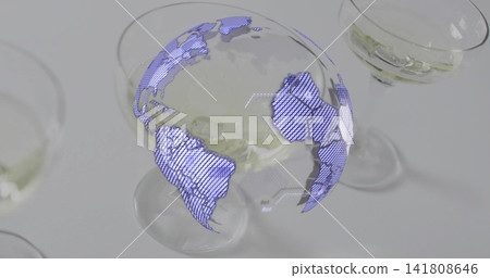 Hovering violet-blue globe hologram above central coupe glass on light tabletop with pale liquid Hovering violet-blue globe hologram above central coupe glass on light tabletop with pale liquid 141808646