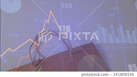 Projecting orange line and blue bar charts over brown kraft paper bag with twisted cord handles Projecting orange line and blue bar charts over brown kraft paper bag with twisted cord handles 141809330