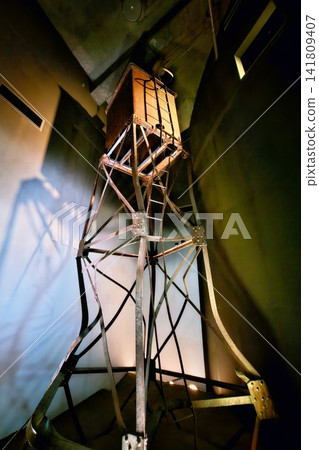 Damaged historic water tower structure from the atomic bombing in Nagasaki displayed in museum for memorial concept background. Damaged historic water tower structure from the atomic bombing in Nagasaki displayed in museum for memorial concept background. 141809407