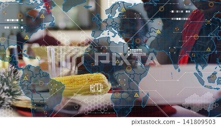 Focusing ear of corn on plate at restaurant, showing map overlay and laptop by red jacket Focusing ear of corn on plate at restaurant, showing map overlay and laptop by red jacket 141809503