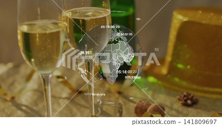 Displaying two champagne flutes sparkling with bubbles on party table, with digital globe overlay Displaying two champagne flutes sparkling with bubbles on party table, with digital globe overlay 141809697