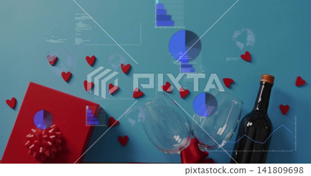 Sitting tied pair stemmed wine glasses on teal surface, with red gift box, hearts, data overlays Sitting tied pair stemmed wine glasses on teal surface, with red gift box, hearts, data overlays 141809698