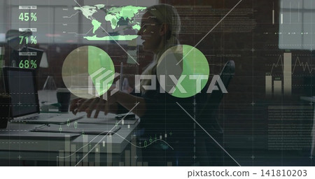 Typing analyst wearing business attire at laptop on desk in open plan office with data overlays Typing analyst wearing business attire at laptop on desk in open plan office with data overlays 141810203