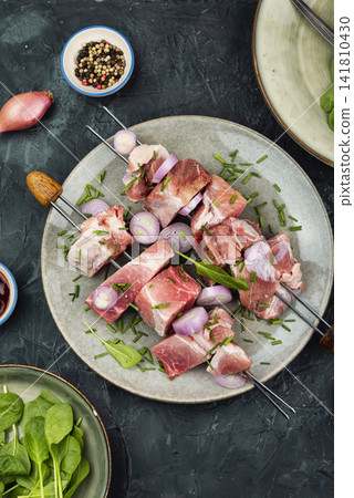 Fresh pork meat skewers ready for BBQ cooking Fresh pork meat skewers ready for BBQ cooking 141810430
