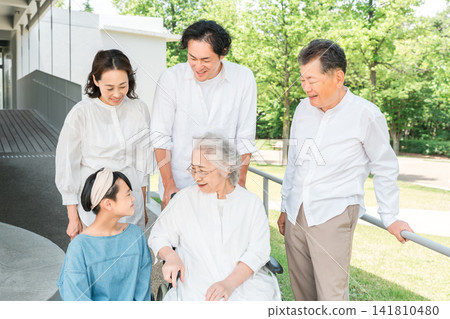 A three-generation family visiting a hospital or nursing home A three-generation family visiting a hospital or nursing home 141810480
