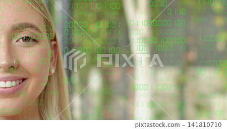 Smiling left adult woman revealing nose ring and stud earring in woods, binary code, copy space 141810710