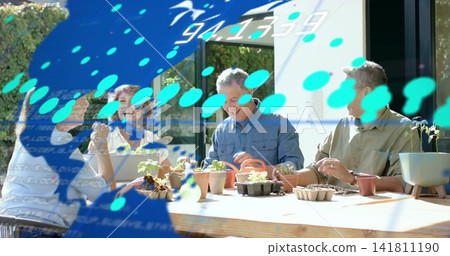 Potting four hobby gardeners wearing casual clothes around wooden table on patio with blue overlay 141811190