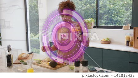 Chopping woman wearing olive top slicing avocado on kitchen island showing purple hologram 37 Chopping woman wearing olive top slicing avocado on kitchen island showing purple hologram 37 141812422